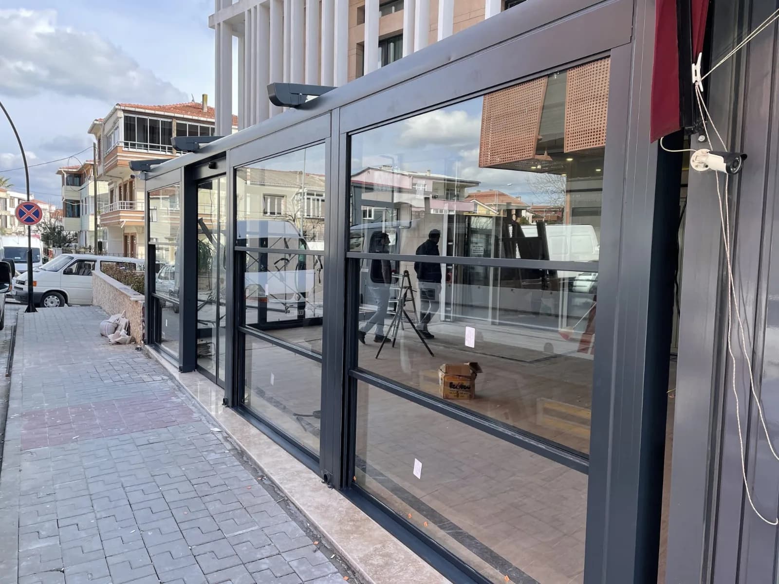 White pergola attached to building with staircase